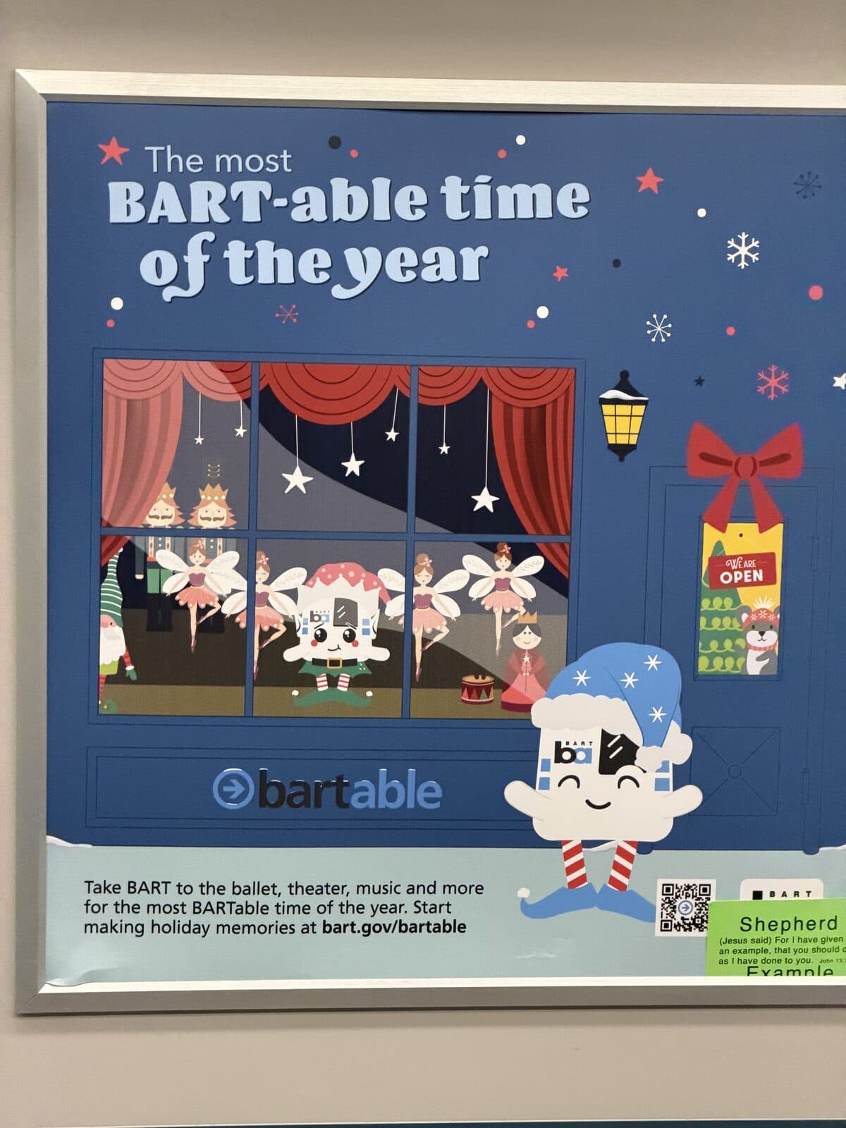 The BARTable logo on a holiday-themed advertisement inside a BART train.