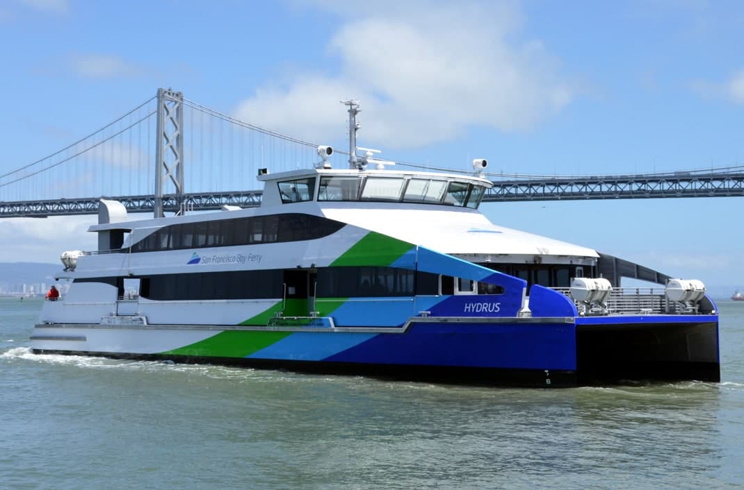 San Francisco Bay Ferry vessel Hydrus underway with the Bay Bridge in the background.